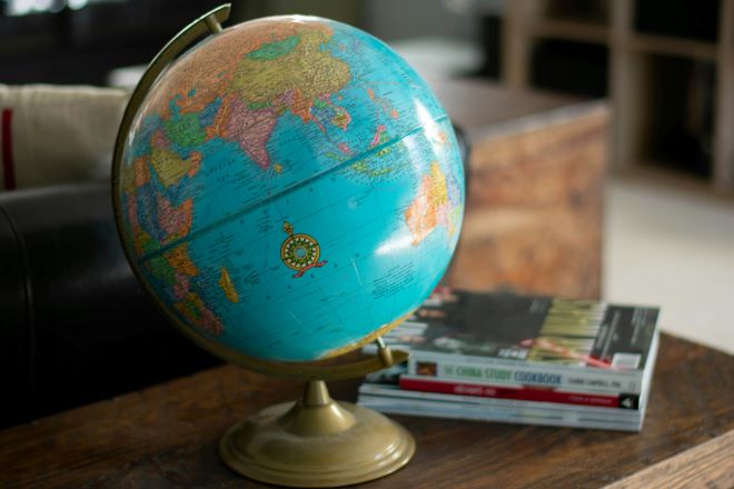 Globe and books on a table. 
