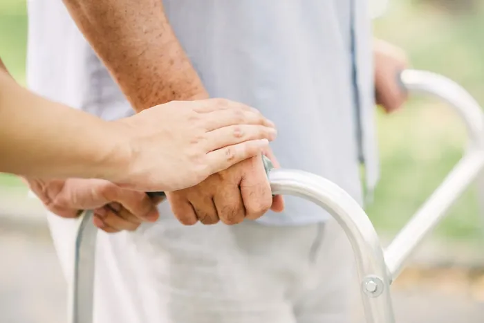 Hand holding a patient