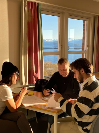 Three students working on the project together at Molde University College.
