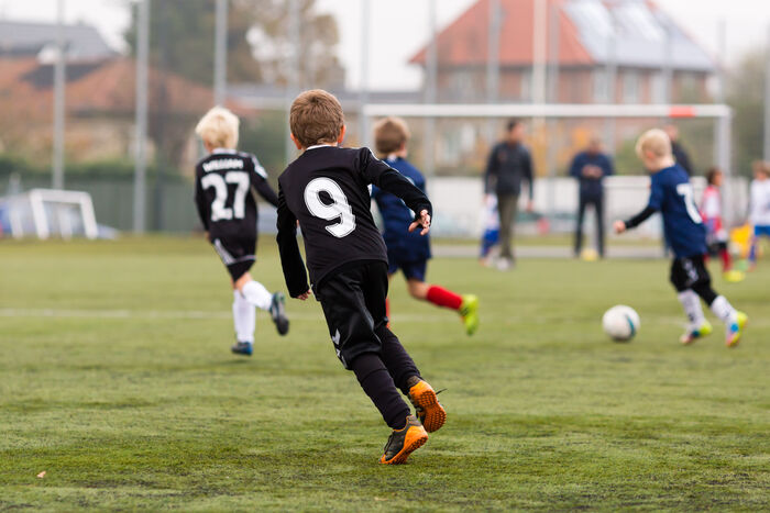 Kids playing football
