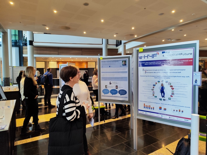 A woman looking at a infographic poster at the national conference