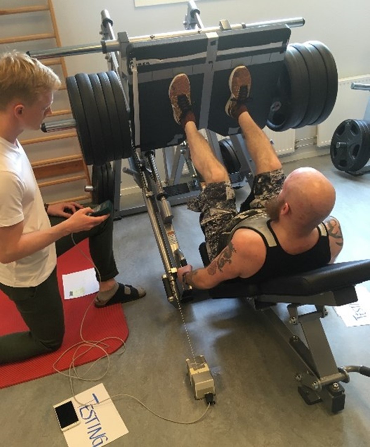 Measuring lower extremity force-generating capacity (strength and power) in the leg press apparatus.